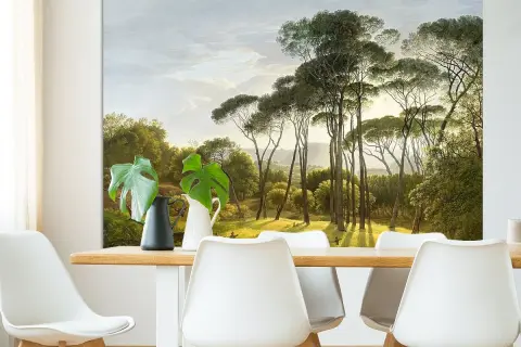 Een schilderij van Hendrik Voogd toont een zonnig landschap met hoge pijnbomen en weelderig groen.