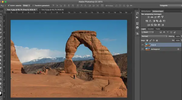 Bewerken van foto's in Photoshop. Delicate Arch in Arches National Park, met aanpassingslagen en lagenpanelen zichtbaar.