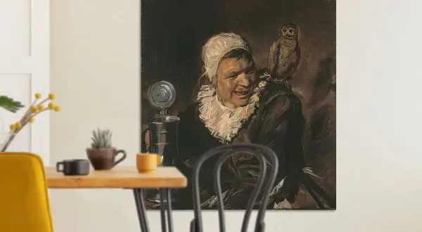 Een schilderij van een "malle babbe" met een uil op haar schouder. Ze draagt een witte kap en een ruime kraag.
