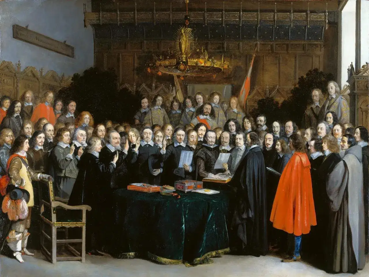Het schilderij van de Vrede van M&uuml;nster toont een groep mannen in formele kledij, bijeen rond een tafel, mogelijk ter ondertekening van een belangrijk verdrag.
